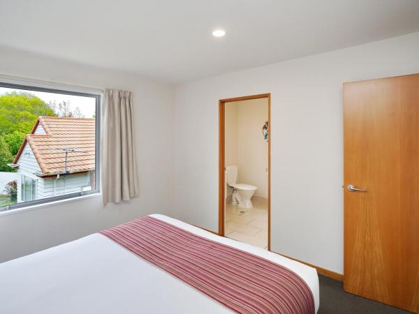 306 Motel Apartments : photo 2 de la chambre appartement 1 chambre avec baignoire spa