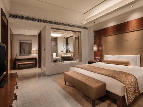 Wanda Realm Resort Sanya Haitang Bay : photo 7 de la chambre suite lit king-size - vue sur océan