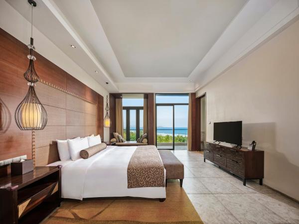 Wanda Realm Resort Sanya Haitang Bay : photo 6 de la chambre suite lit king-size - vue sur océan