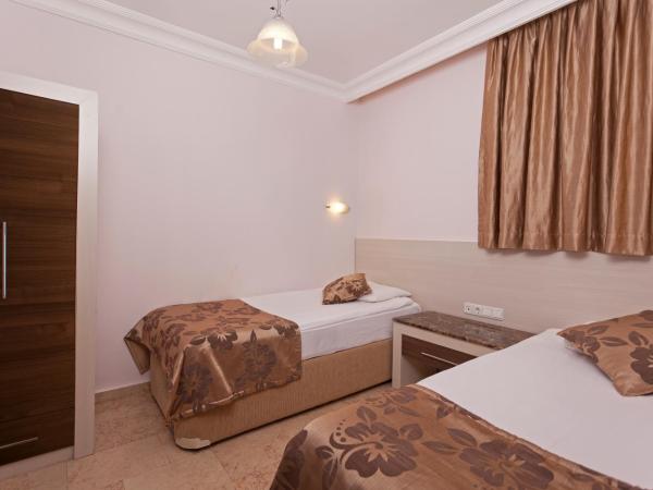Club Paradiso Hotel & Resort : photo 3 de la chambre suite familiale