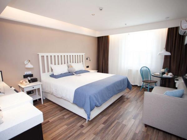 银座精宿(黄岛金沙滩香江路商业街店) : photo 1 de la chambre chambre double select