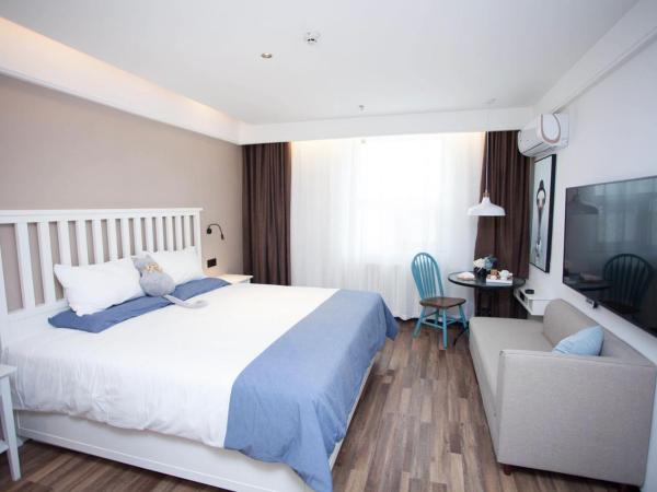 银座精宿(黄岛金沙滩香江路商业街店) : photo 2 de la chambre chambre double select