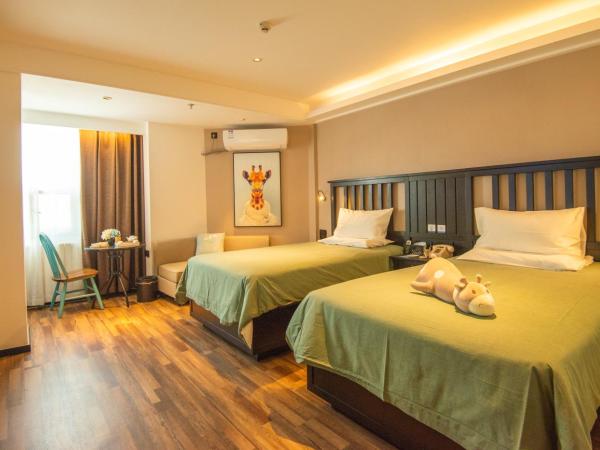 银座精宿(黄岛金沙滩香江路商业街店) : photo 2 de la chambre chambre lits jumeaux select