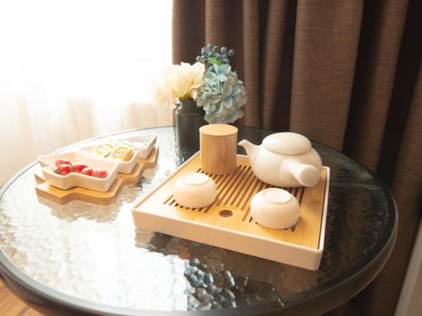 银座精宿(黄岛金沙滩香江路商业街店) : photo 2 de la chambre selected double room with audio 