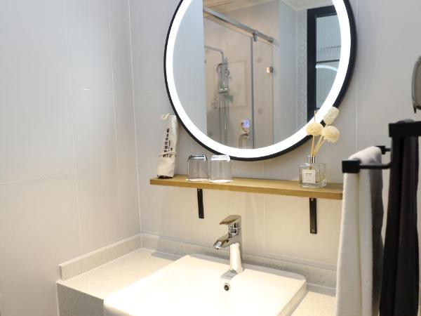 银座精宿(黄岛金沙滩香江路商业街店) : photo 3 de la chambre chambre lits jumeaux select