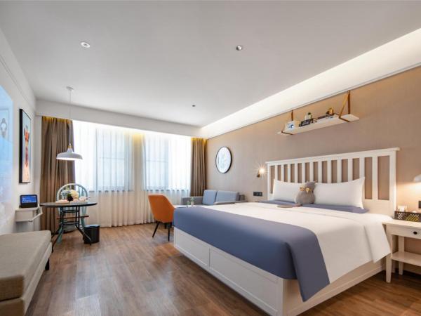 银座精宿(黄岛金沙滩香江路商业街店) : photo 1 de la chambre selected double room with audio 