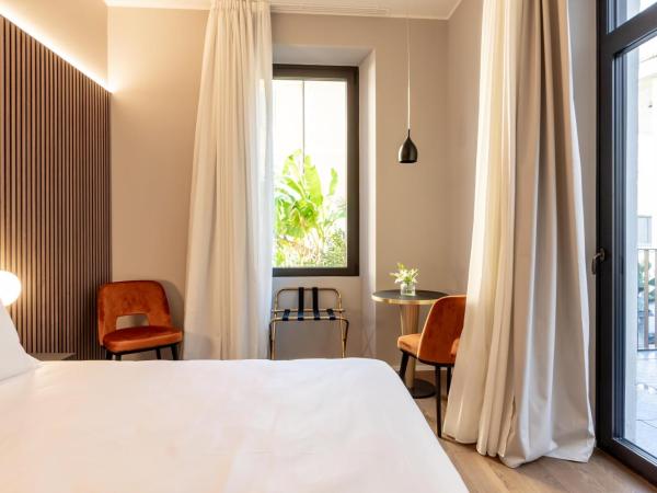 Binario 934 Smart Hotel : photo 1 de la chambre chambre lit queen-size avec balcon