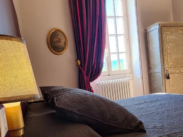 Chambres d'hotes le Domaine de Romanil : photo 1 de la chambre chambre lit queen-size