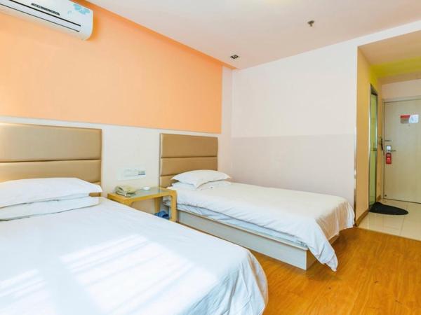 银座精宿(黄岛金沙滩香江路商业街店) : photo 1 de la chambre chambre lits jumeaux standard