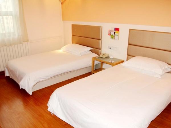 银座精宿(黄岛金沙滩香江路商业街店) : photo 4 de la chambre chambre lits jumeaux standard