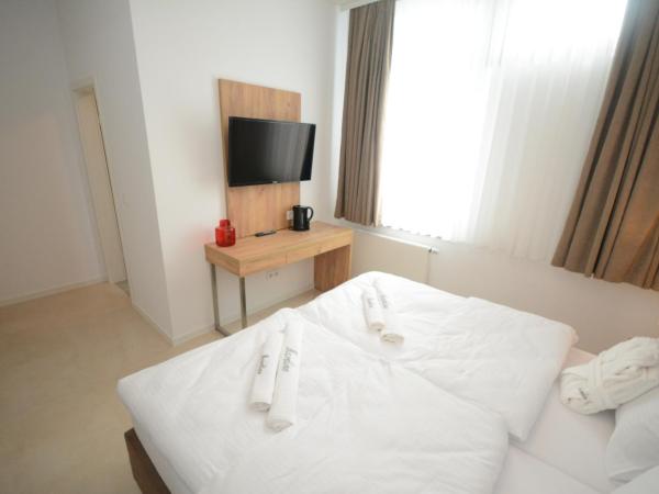 Hannover Zimmervermietung Mardino : photo 5 de la chambre chambre double ou lits jumeaux avec douche