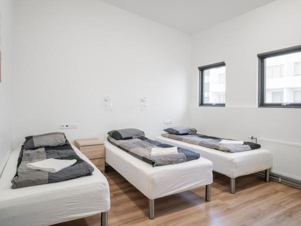 Guesthouse Pavi : photo 2 de la chambre chambre triple avec salle de bains commune