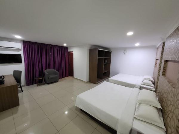 Poorna Hotel : photo 3 de la chambre chambre familiale supérieure