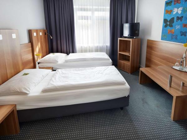 GHOTEL hotel & living Hannover : photo 1 de la chambre chambre affaires lits jumeaux