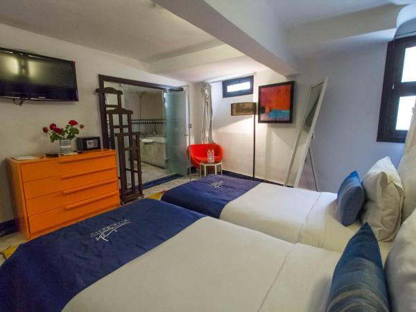 Riad Braya : photo 2 de la chambre chambre lits jumeaux avec salle de bains privative