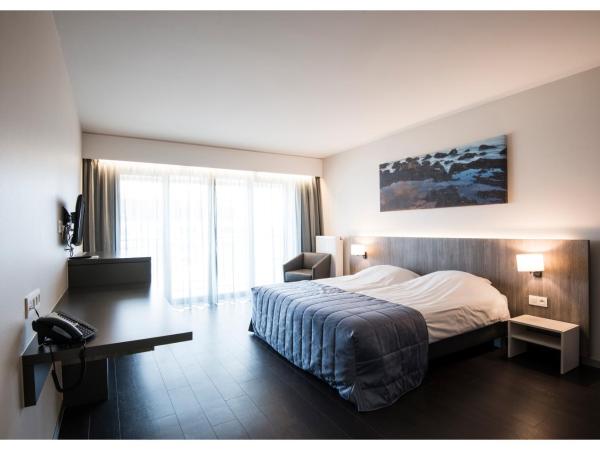 Vayamundo Oostende : photo 2 de la chambre chambre lits jumeaux - vue sur ville