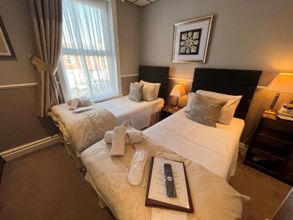 Raffles Hotel : photo 1 de la chambre chambre lits jumeaux avec douche