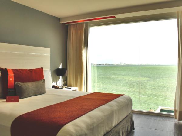 Real Inn Cancún : photo 6 de la chambre hébergement lit king-size deluxe - vue sur lagon