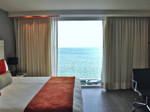 Real Inn Cancún : photo 5 de la chambre hébergement lit king-size deluxe - vue sur lagon