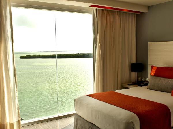Real Inn Cancún : photo 4 de la chambre hébergement double exécutif - vue sur lagon