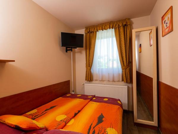 Erika Vendégház : photo 5 de la chambre chambre triple deluxe