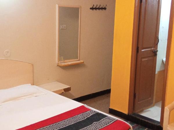 SRI VIJAYA PALACE LODGING : photo 4 de la chambre chambre lit king-size deluxe