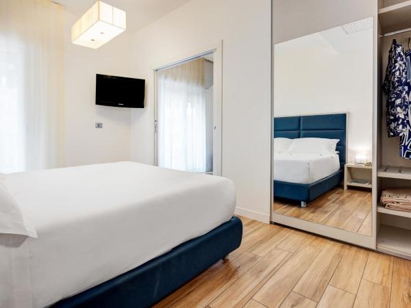 Hotel Nettuno : photo 1 de la chambre chambre familiale supérieure