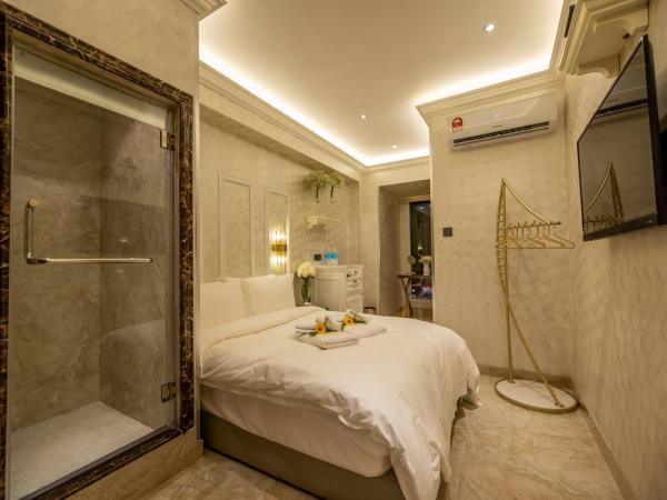 A Residence @ Between Hilton & Cititel Hotel : photo 1 de la chambre chambre double deluxe