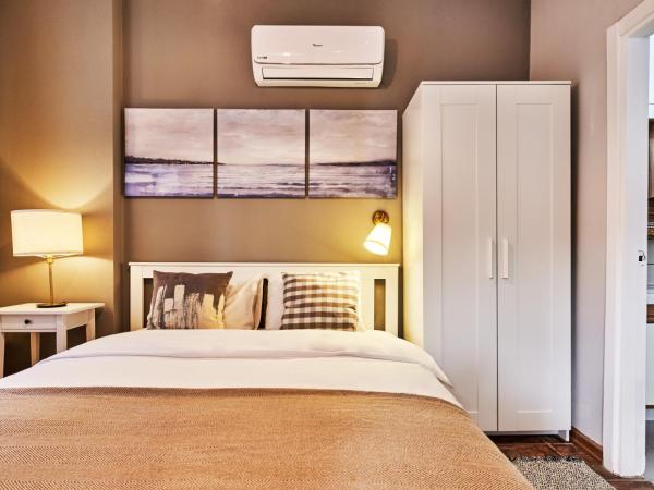 Cicerone Apart : photo 2 de la chambre appartement - vue sur jardin