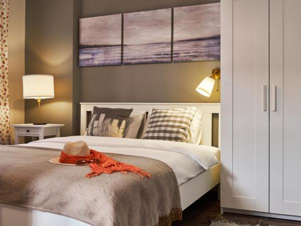Cicerone Apart : photo 3 de la chambre appartement - vue sur jardin