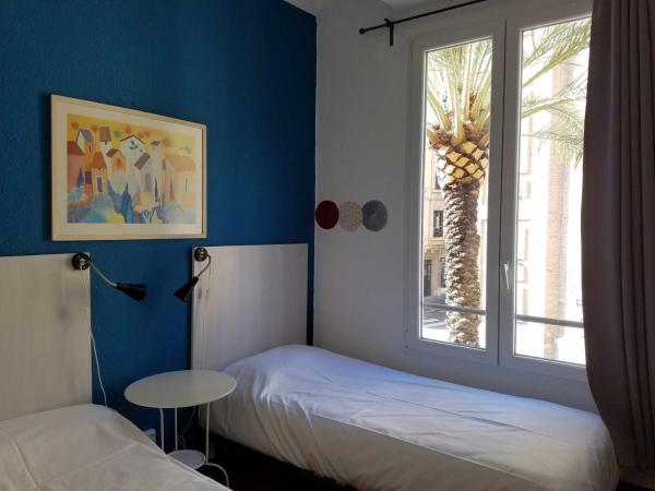 Russafa Youth Hostel : photo 7 de la chambre chambre lits jumeaux avec salle de bains commune