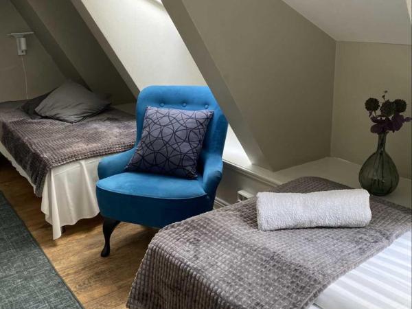 Lilla Brunn : photo 7 de la chambre chambre lits jumeaux avec salle de bains commune