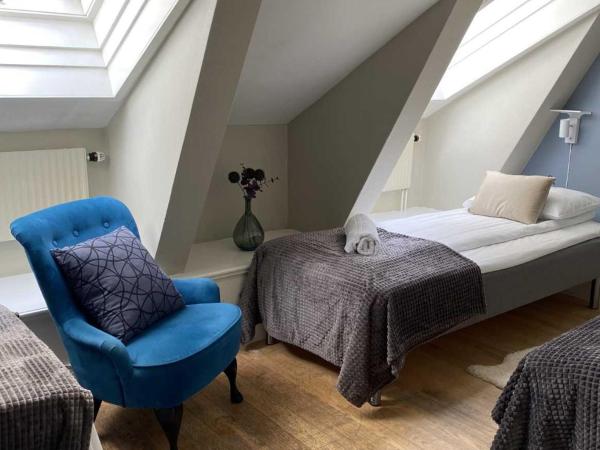 Lilla Brunn : photo 10 de la chambre chambre lits jumeaux avec salle de bains commune