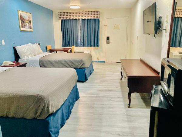 Americas Best Value Inn and Suites Houston/Northwest Brookhollow : photo 1 de la chambre hébergement standard avec 2 lits queen-size