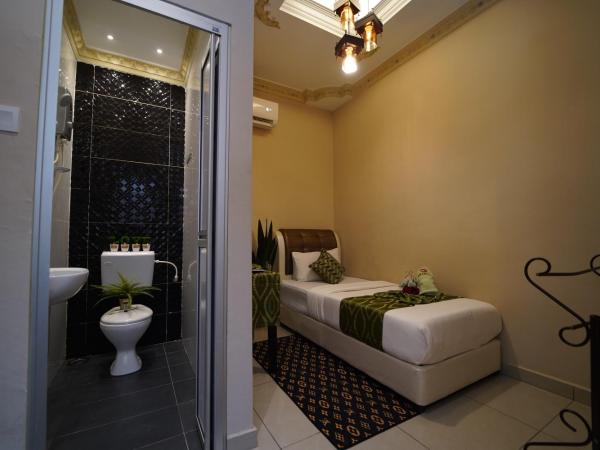 Ghazrin's Classic : photo 1 de la chambre chambre simple avec salle de bains privative