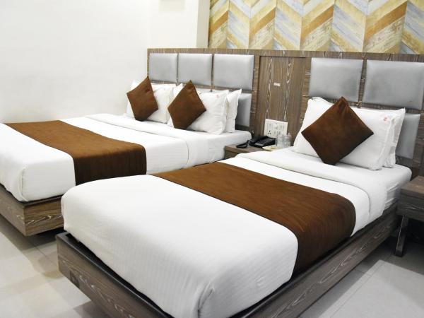 Hotel Sanjary Palace : photo 2 de la chambre chambre triple deluxe