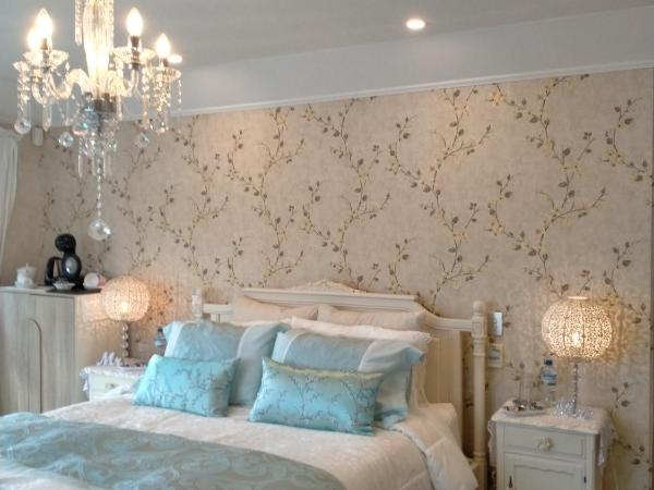 Amberly House Rotorua : photo 1 de la chambre suite deluxe avec lit king-size