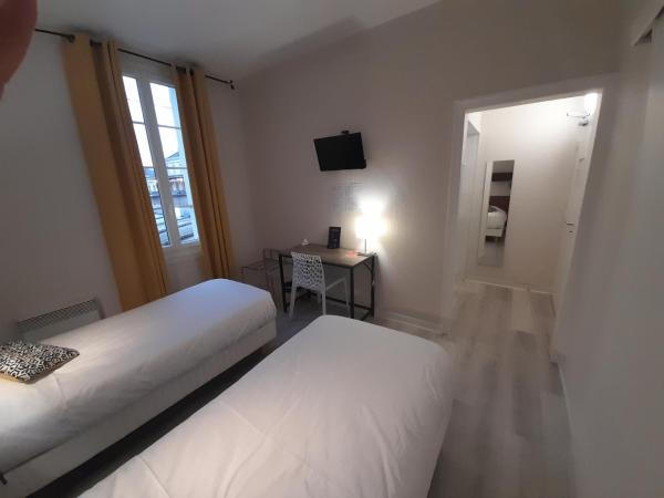 Contact Hotel de France : photo 8 de la chambre chambre lits jumeaux