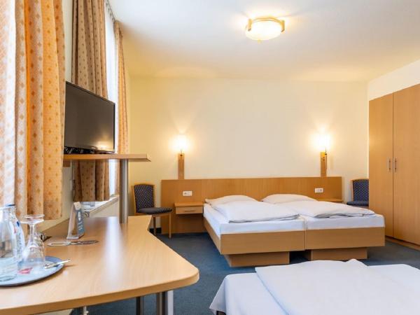 Trip Inn Hotel Conti : photo 2 de la chambre chambre triple