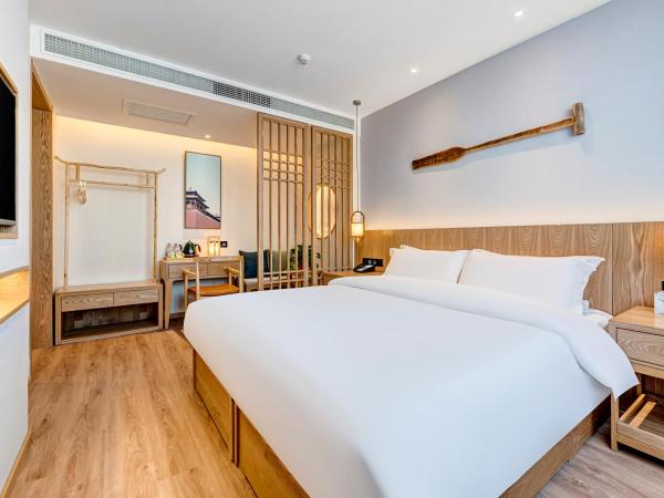 Happy Dragon Universal Vacation Hotel - close to Universal Studio and Wanda Plaza,free pick up to the studio,Free Coffee,Laundry : photo 3 de la chambre chambre lit queen-size deluxe