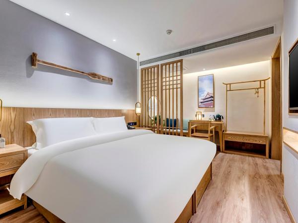 Happy Dragon Universal Vacation Hotel - close to Universal Studio and Wanda Plaza,free pick up to the studio,Free Coffee,Laundry : photo 4 de la chambre chambre lit queen-size deluxe