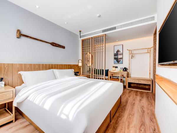 Happy Dragon Universal Vacation Hotel - close to Universal Studio and Wanda Plaza,free pick up to the studio,Free Coffee,Laundry : photo 2 de la chambre chambre lit queen-size deluxe