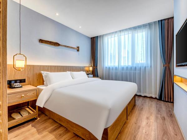 Happy Dragon Universal Vacation Hotel - close to Universal Studio and Wanda Plaza,free pick up to the studio,Free Coffee,Laundry : photo 5 de la chambre chambre lit queen-size deluxe