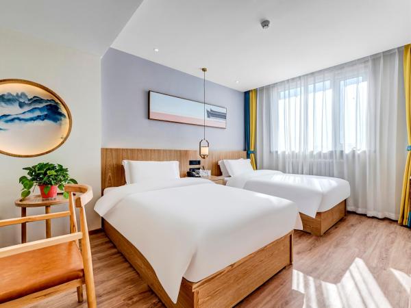 Happy Dragon Universal Vacation Hotel - close to Universal Studio and Wanda Plaza,free pick up to the studio,Free Coffee,Laundry : photo 1 de la chambre chambre lits jumeaux deluxe