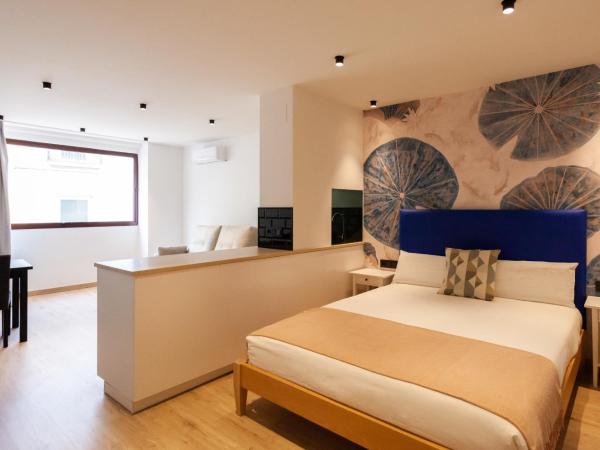 Welldone Sierpes Boutique : photo 3 de la chambre suite lit queen-size