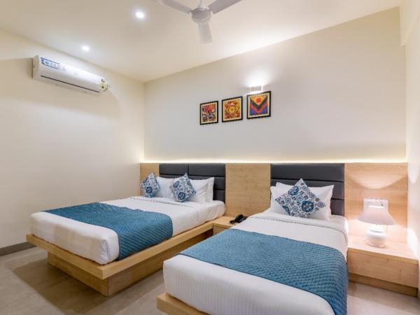 Iris Suites : photo 2 de la chambre chambre lits jumeaux