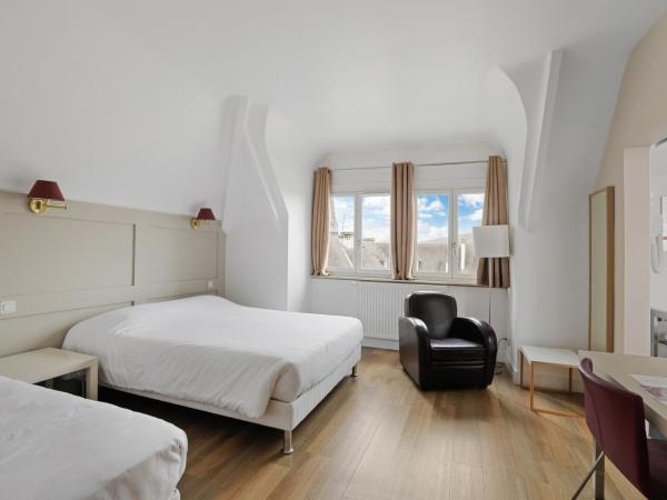 Hôtel Cardinal : photo 1 de la chambre chambre triple