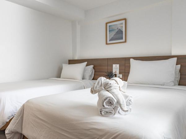 Sovereign Group Hotel at Pratunam : photo 1 de la chambre chambre lits jumeaux deluxe