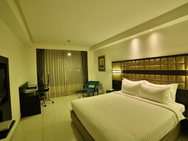 HOTEL G EXPRESS Formerly Known as TGB Express : photo 2 de la chambre deluxe room (locals and unmarried couples are not allowed)