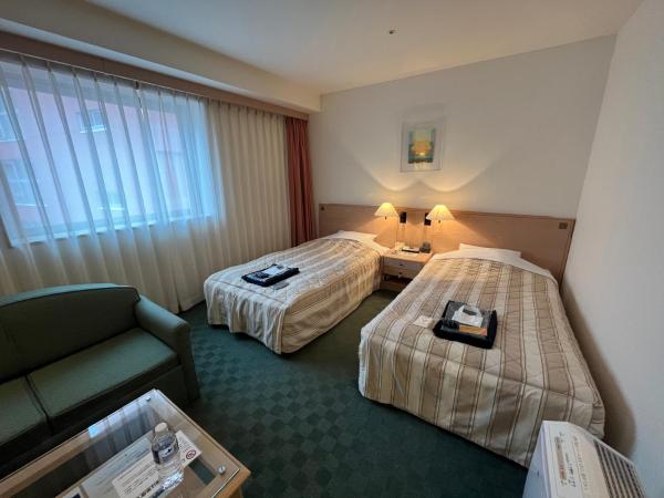 Jasmac Plaza Hotel : photo 3 de la chambre chambre lits jumeaux - annexe - fumeurs